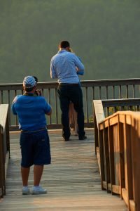 Robinson Engagement Photo at McCloud Mountain. Photographer Dwayne Hickson photographing the moment.