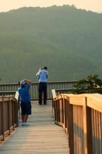 Robinson Engagement Photo at McCloud Mountain. Photographer Dwayne Hickson photographing the moment.